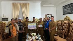 Pemerintah Kabupaten Kampar Salurkan Donasi Tunai untuk Korban Bencana di Kabupaten Lima Puluh Kota